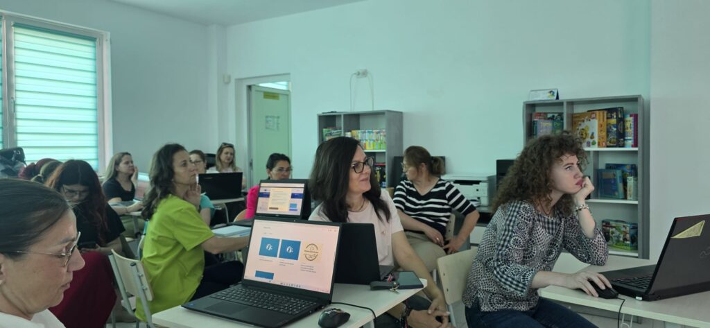 teachers working on laptops